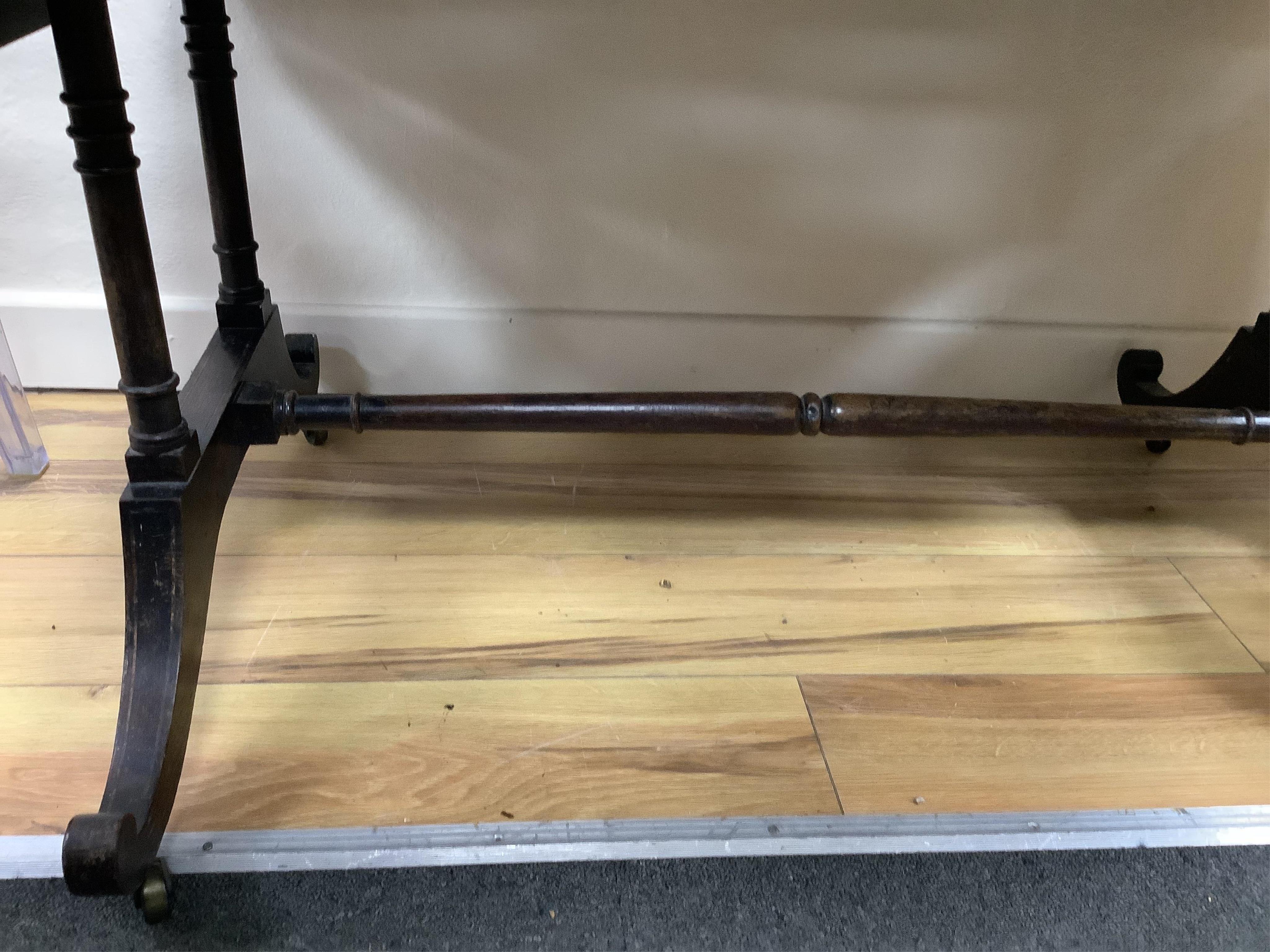 A Regency satinwood banded rosewood sofa table, width 92cm, depth 66cm, height 71cm. Condition - fair